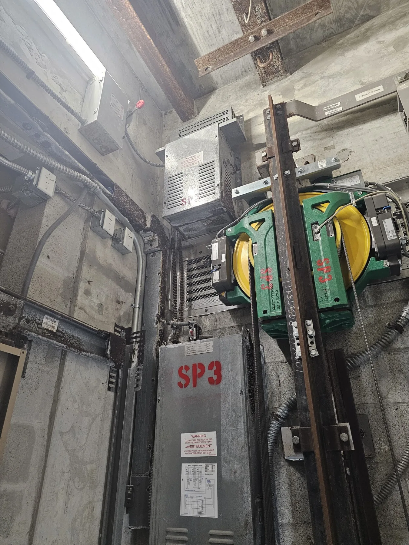 Vertical elevator shaft with rails and machinery